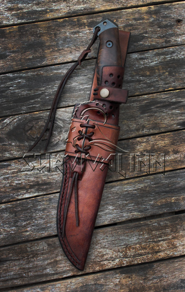 Close-up of tactical Bowie knife featuring polished rosewood handle and stitched leather sheath