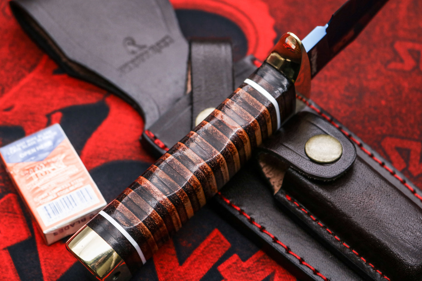 Side profile of SOG Bowie knife showing sleek blued blade and durable leather handle