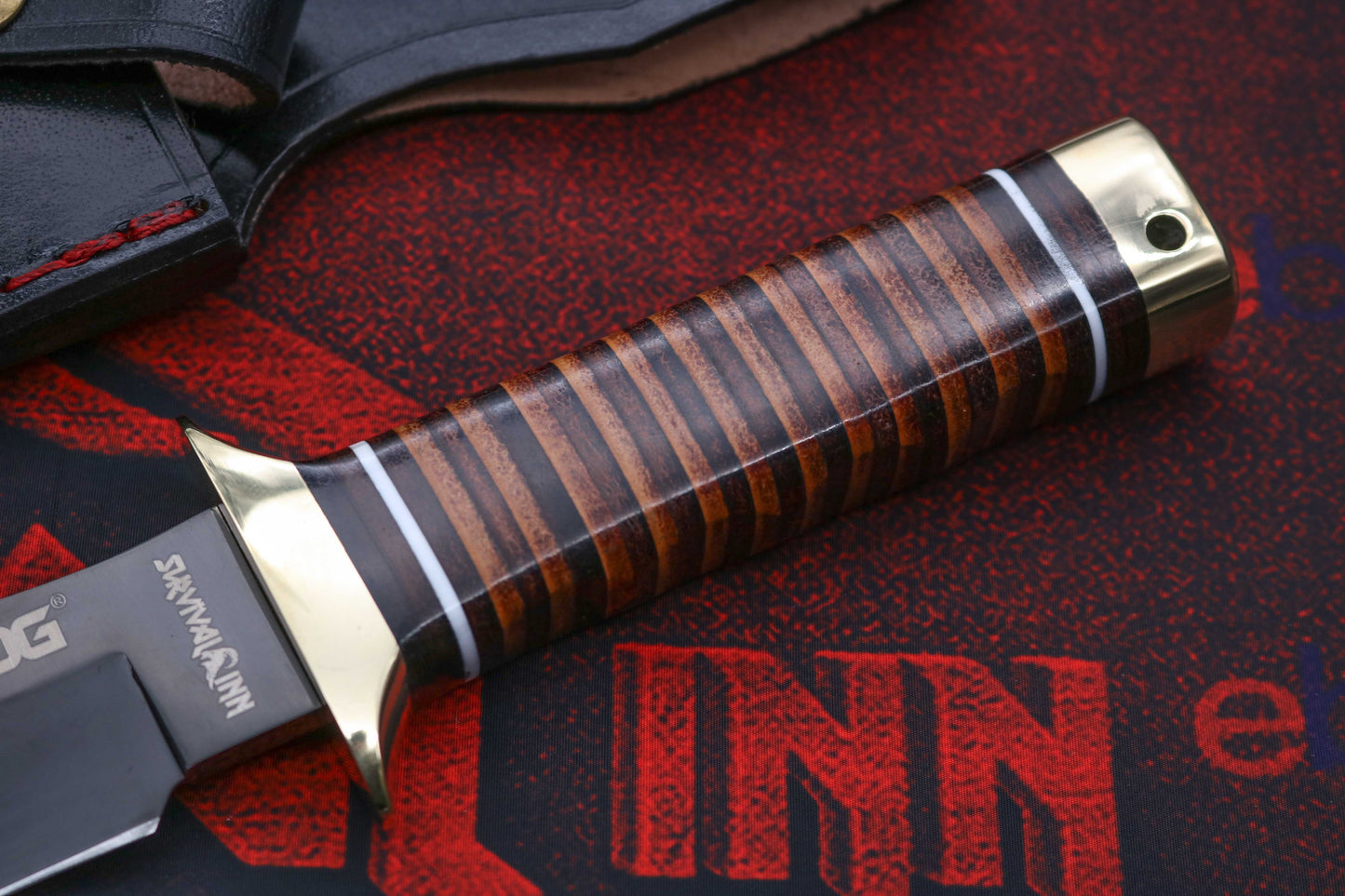Ergonomic stacked leather grip handle on handcrafted SOG Bowie knife for secure hold