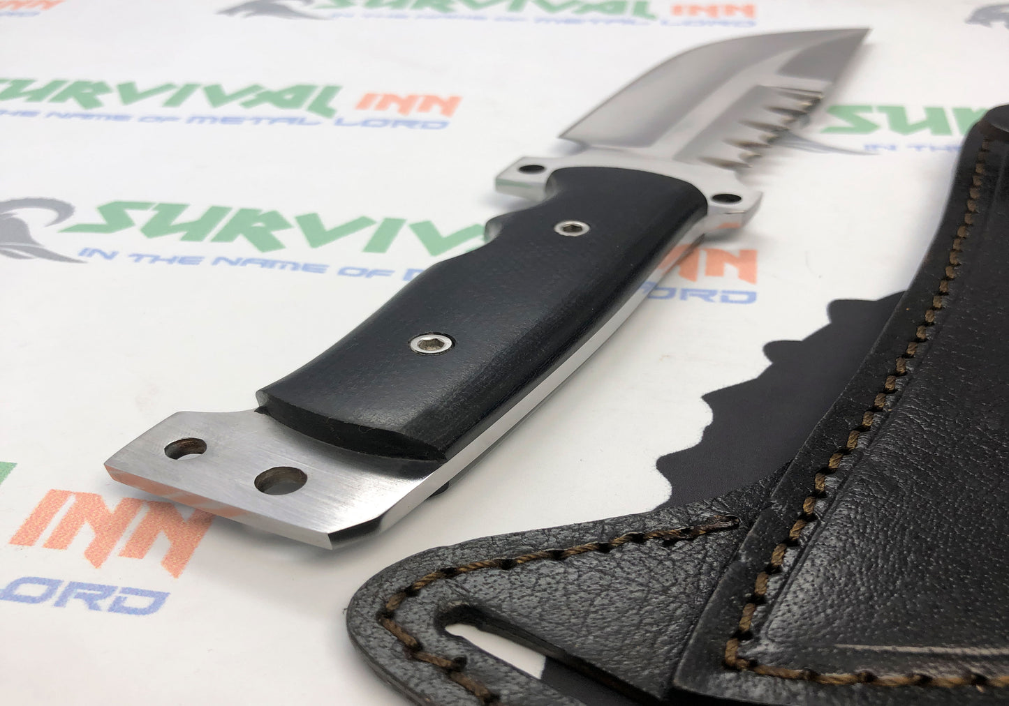 Textured non-slip handle of tactical hunting knife for secure outdoor use