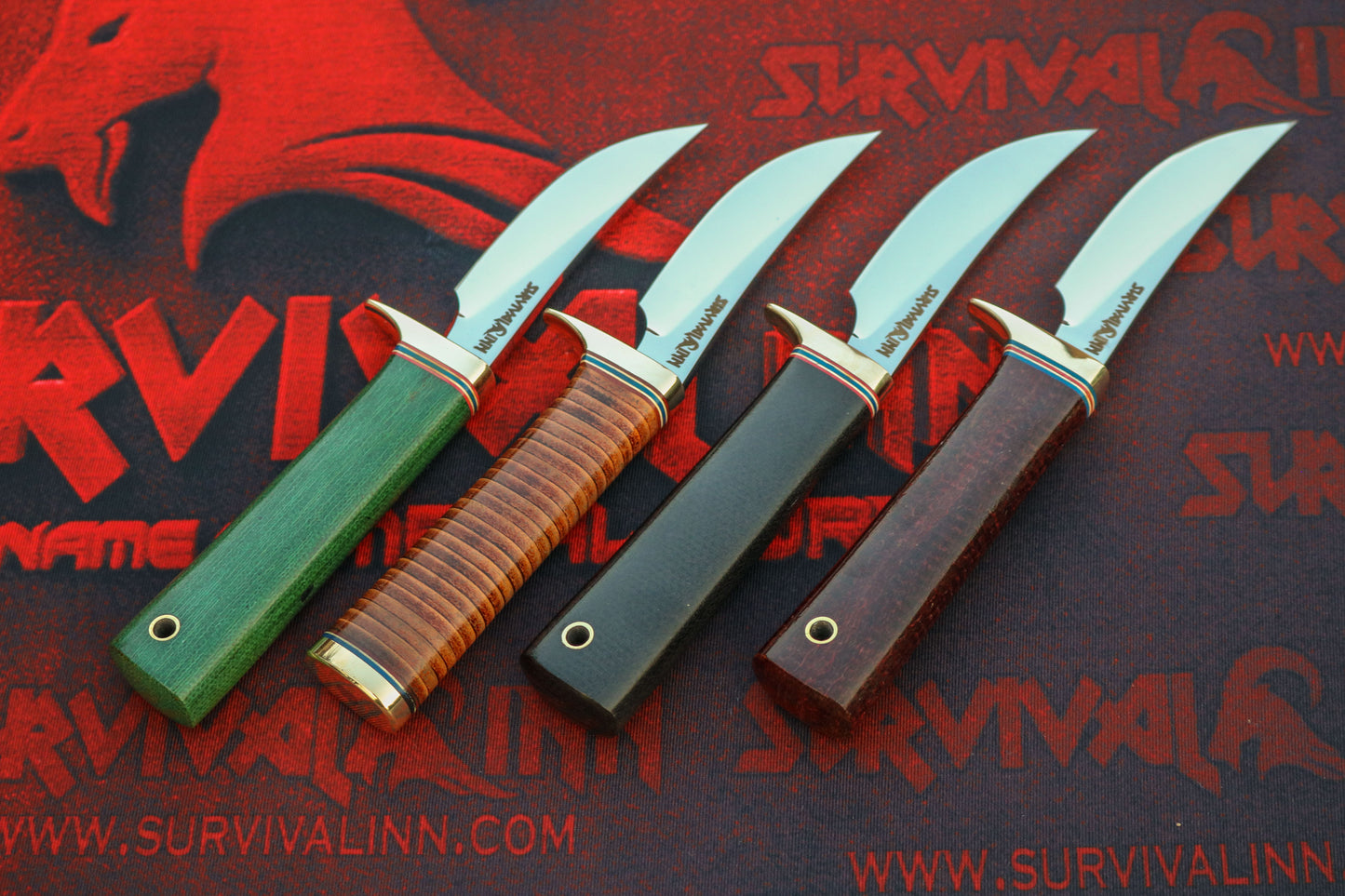Four knives with different colored handles on a red and black 'Survival Inn' background.