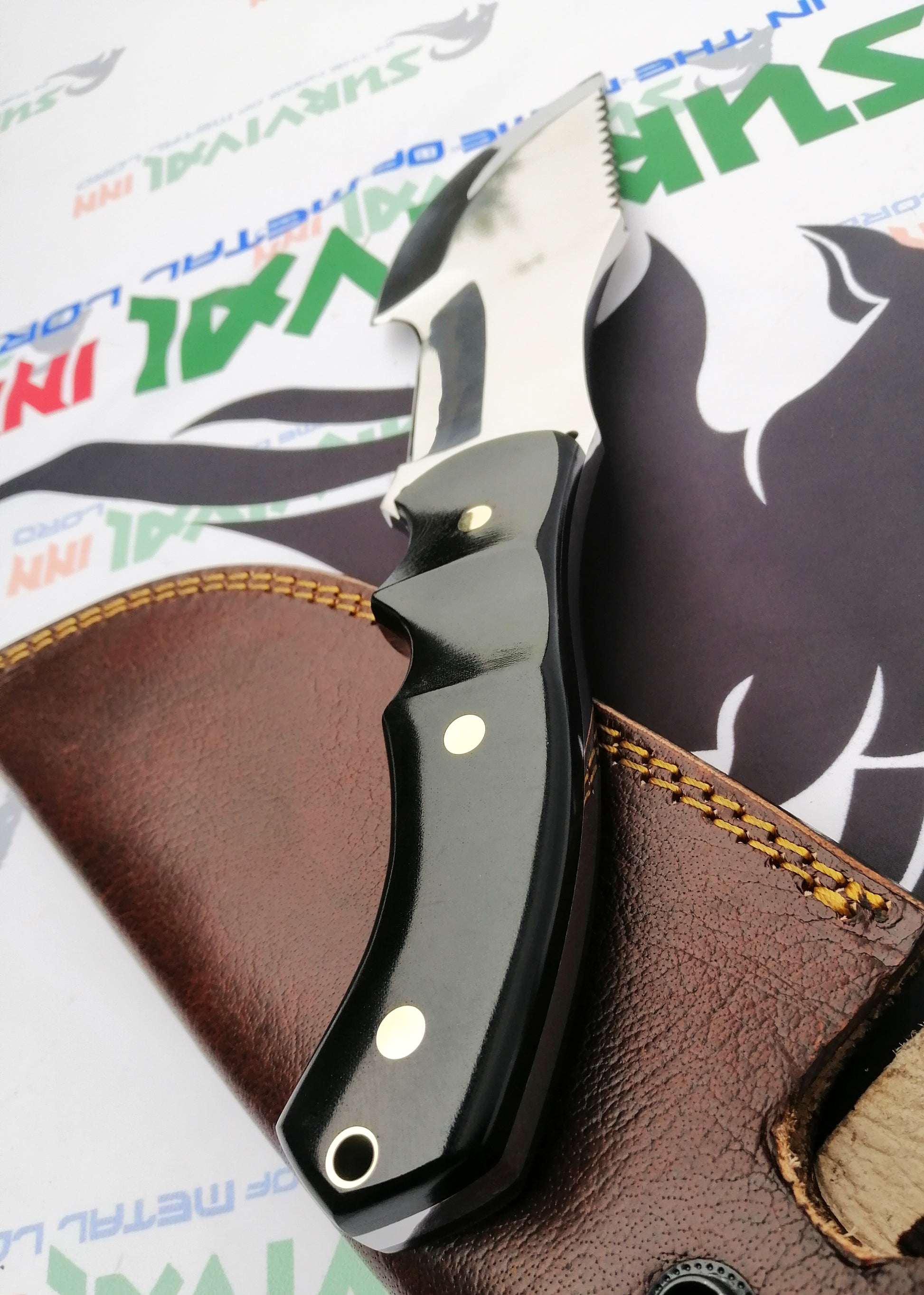 Ergonomic handle detail of Hunted movie tracker knife for secure grip