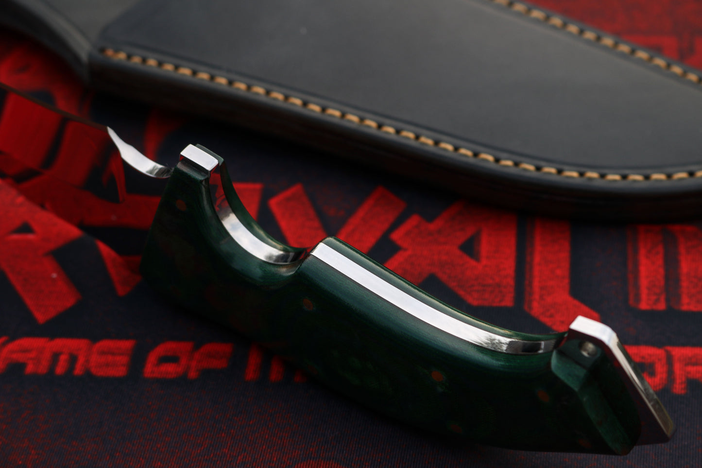 Handcrafted Bowie knife spine and blade detail showing heavy-duty D2 steel construction