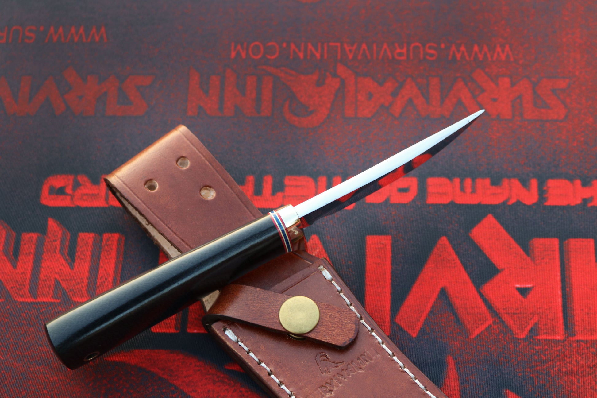 Randall Model 20 Yukon Skinner knife displayed with leather sheath and Micarta handle
