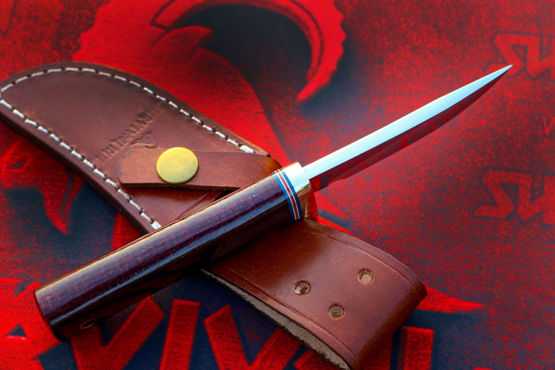 Randall Model 20 Yukon Skinner knife displayed with leather sheath and Micarta handle