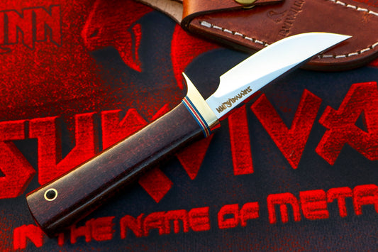 Randall Model 20 Yukon Skinner knife with 4.5 inch O-1 steel blade and red Micarta handle