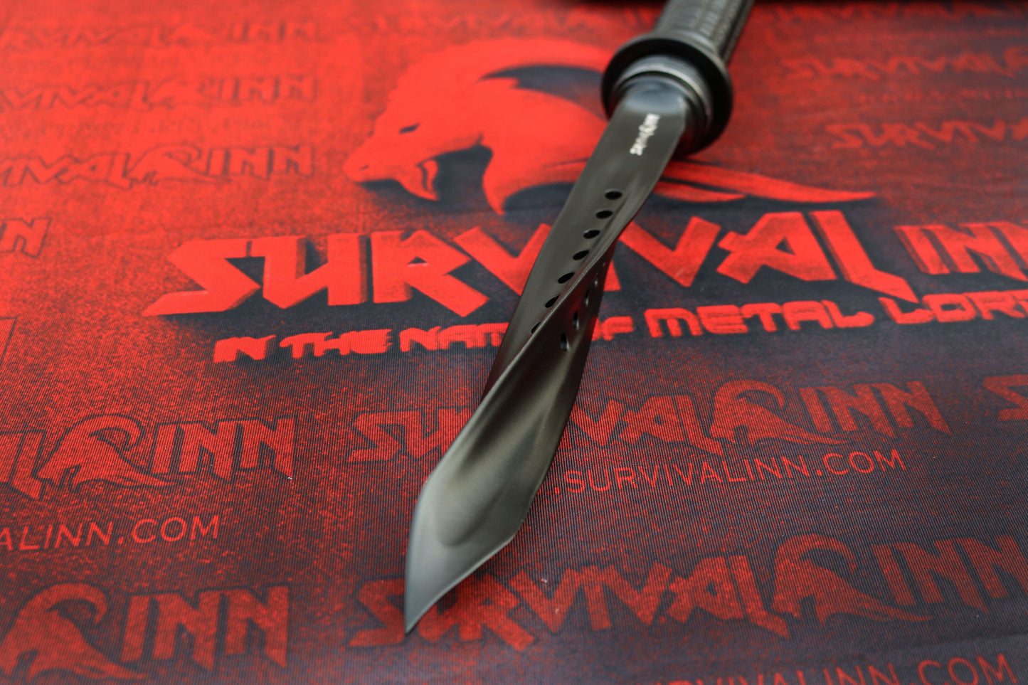 Detailed view of the twisted triangular blade tip of the tri-dagger