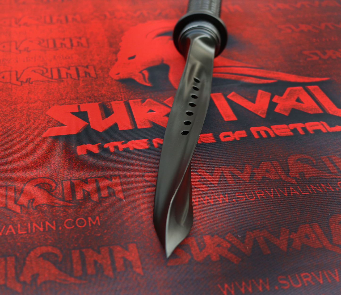 Detailed view of the twisted triangular blade tip of the tri-dagger