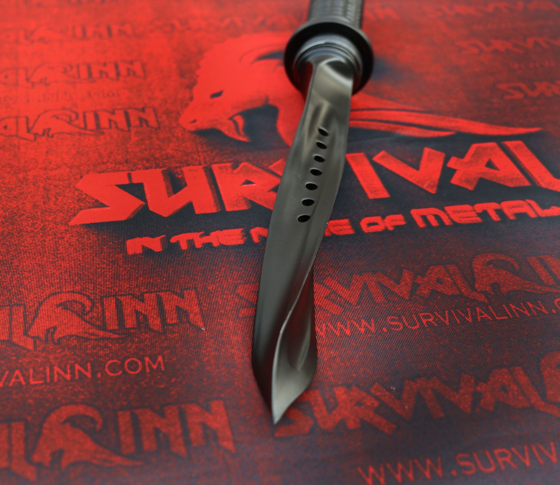 Detailed view of the twisted triangular blade tip of the tri-dagger