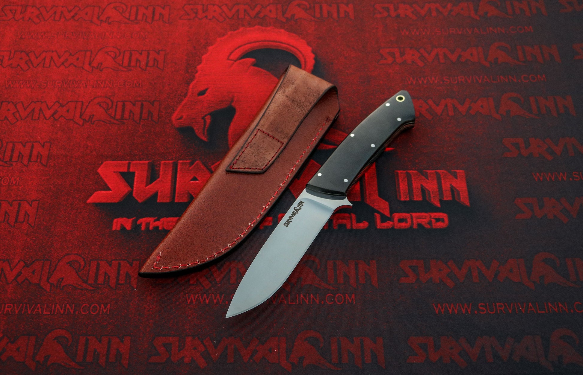 Loveless-style drop point knife comfortably held in the hand, demonstrating ergonomic design for hunting