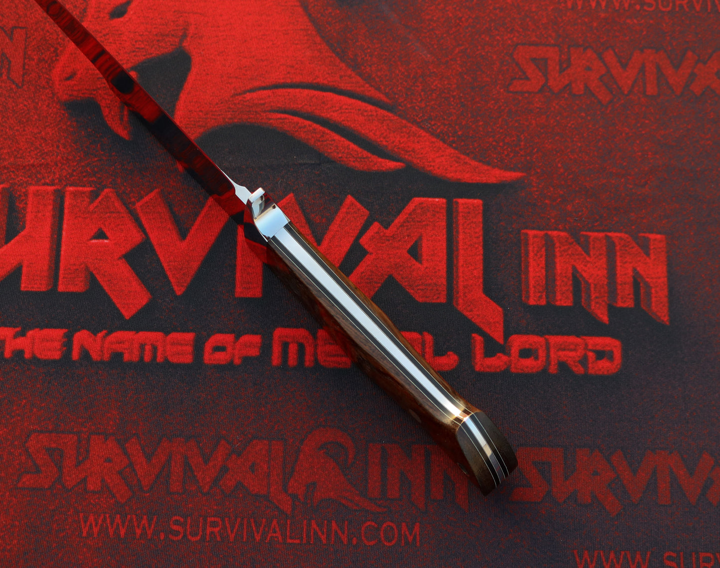 Loveless Drop Point Hunter with tapered tang and stainless guard