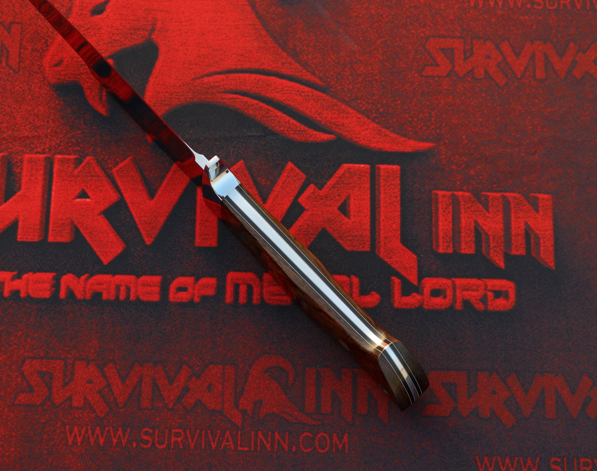 Loveless Drop Point Hunter with tapered tang and stainless guard