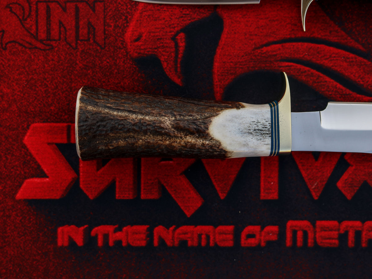 Randall Model 8 Trout and Bird hunting knife with stag antler handle displayed alongside its classic fixed blade.