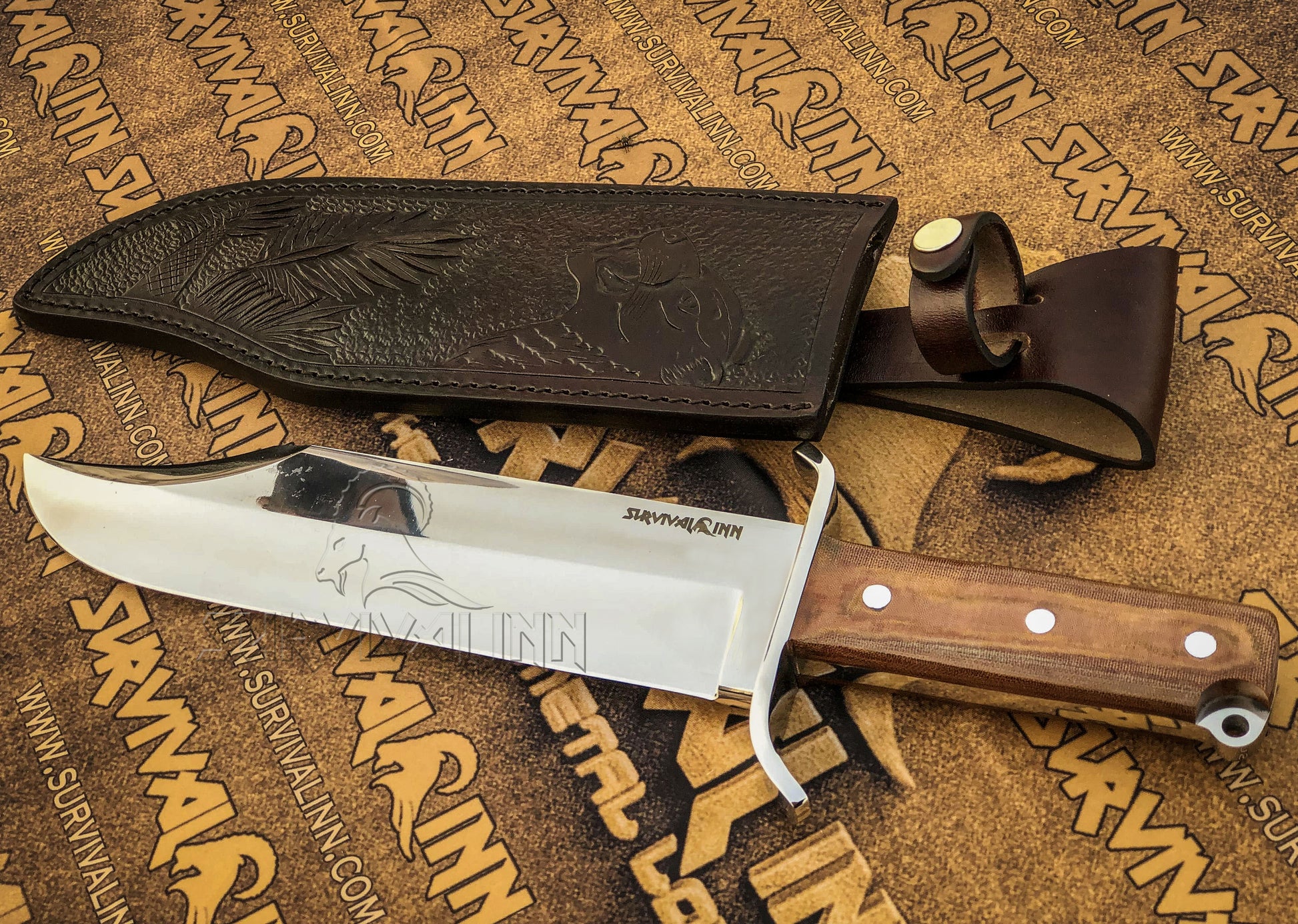 Custom hand-stitched leather sheath with the Bowie knife inside, showcasing belt loop and secure fit for field carr